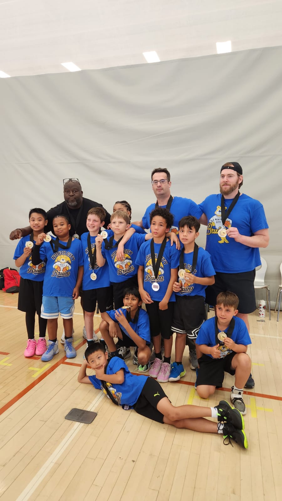 North City Bruins players and coaches celebrating their silver medals
